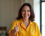 Happy customer giving a thumbs-up in clean home