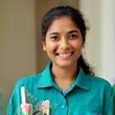 Priya Raj with cleaning tools smiling in uniform
